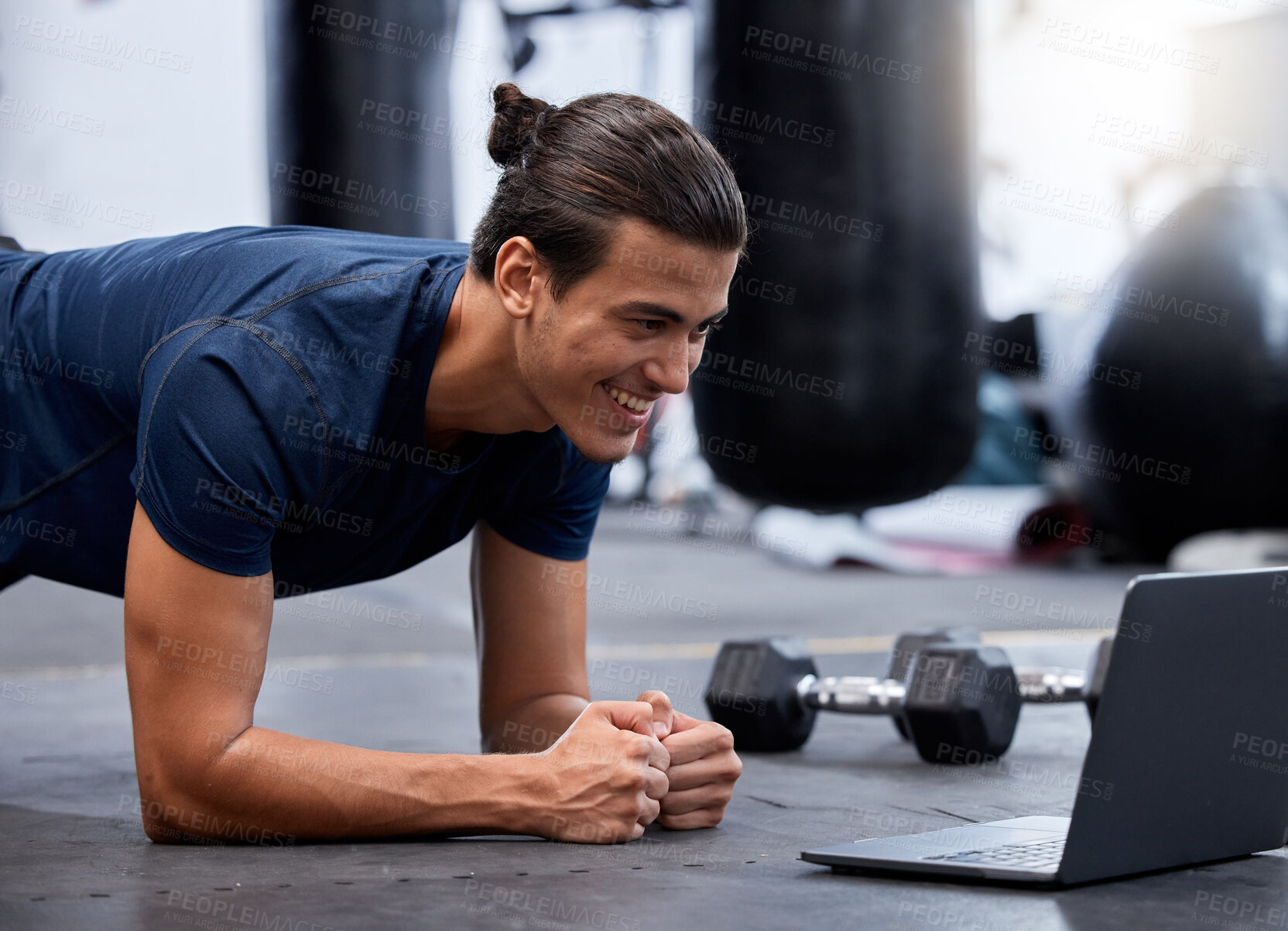 Buy stock photo Exercise, laptop and personal trainer do virtual workout video on internet streaming or watching tutorial for fitness. Content creator or influencer man at gym for pushup or plank training online
