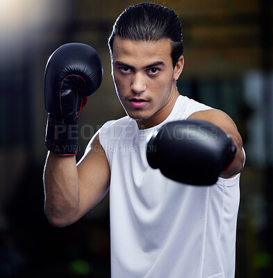 Buy stock photo Gym, fitness and portrait of man boxing with focus and motivation for health, training and self defense. Workout goals, exercise and wellness, strong boxer at city studio or club with boxing gloves.