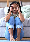 Black woman, headache and stress on floor in home for mental health, depression and frustrated student for university burnout. Depressed, college anxiety and african girl tired or pain in living room