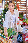 Market, food and woman buying vegetables for groceries to cook healthy, nutrition and organic dinner. Diet, vitamins and Asian girl customer shopping for health, raw and fresh produce at farmer stall