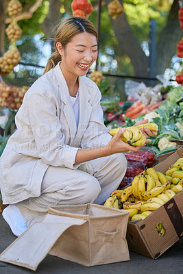 Buy stock photo Bananas, shopping and Asian woman at outdoor market buying delicious and healthy fruits. Plantains, products and female from Japan purchasing fruit at street stall for vitamin c, health and wellness.