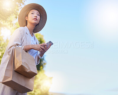 Buy stock photo Asian, woman with bags and shopping with smartphone mockup for internet deals, online sales and ecommerce promo outdoors. Japanese customer, retail and online shopping waiting for taxi with cellphone