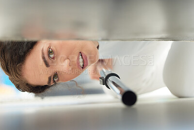 Buy stock photo Cleaning, vacuum and face of woman under sofa for housework or hygiene. Spring cleaning, machine and portrait of female cleaner vacuuming floor to remove dust or dirt in home living room or lounge.