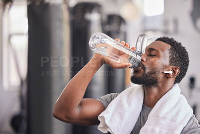 Buy stock photo Water bottle, tired black man in gym and resting after fitness workout, healthy sports exercise and muscle growth training. Rest, motivation and thirsty athlete drinking water for hydration wellness 