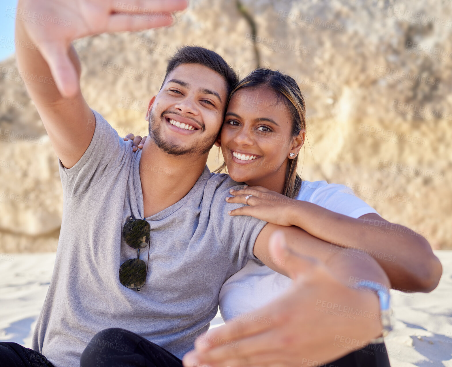 Buy stock photo Couple, portrait smile and selfie on the beach for happy free bonding or relaxing time together in the outdoors. Man and woman smiling in relationship happiness for photo, capture or moments at sea