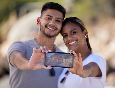 Buy stock photo Happy couple, phone selfie and screen in nature, smile and memory on vacation in summer sunshine. Couple, love and romance with digital picture, smartphone and happiness for social media in Jakarta