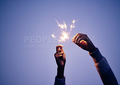Buy stock photo Sparkler, hand and person at night for new years eve celebration with bright, burning fun to celebrate. Celebrating, sparkle and blue nighttime background with a firework or firecracker in hands