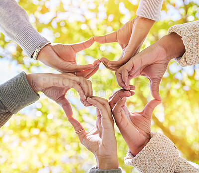 Buy stock photo Heart, nature or hands with love sign for support, solidarity or peaceful harmony in park in summer. Teamwork, trust or low angle of friends with hand gestures for growth, community or faith in hope