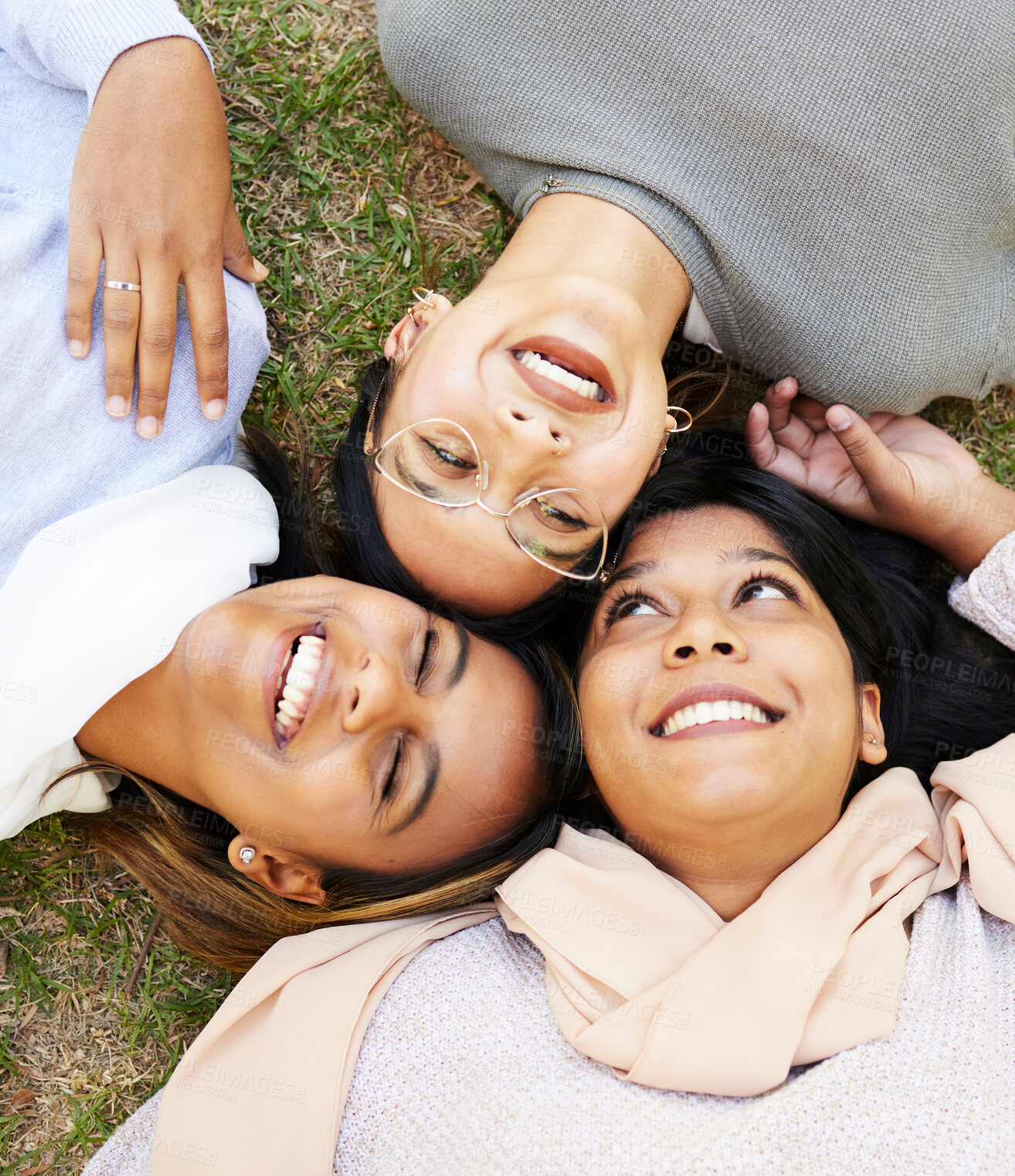 Buy stock photo Friends, happy and relax with laugh, face and enjoy fun quality time together in outdoor nature park. Grass floor, top view and face of happy women smile and support on holiday in Miami, florida