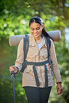 Hiking, travel and woman with trekking pole for stability or mobility outdoors. Freedom, adventure or happy female hiker from India exercise or training with walking stick for tough terrain in nature