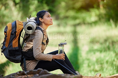 Buy stock photo Black woman, hiking and rest sitting in nature, woods or forest for goal, motivation or outdoor adventure. Woman hiker, water bottle and tired on trail for wellness, fitness or trekking in California