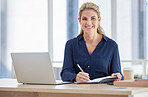 Portrait, business woman and writing in book in office with laptop on desk. Face, notes and happy female manager from Canada with notebook, diary or journal for schedule, marketing ideas or planning.
