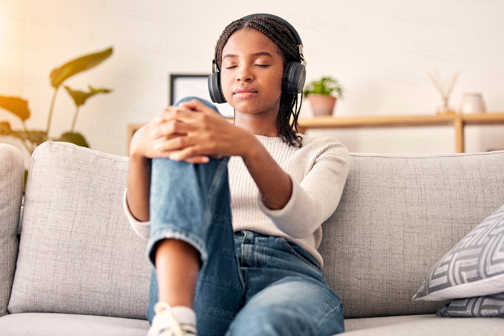 Buy stock photo Music headphones, peace and relax girl listening to wellness podcast for calm mindset, mindfulness or audio meditation. Easy meditating, living room sofa or gen z black woman streaming zen radio song