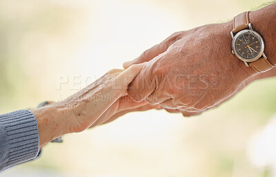 Buy stock photo Holding hands, support and trust with senior couple, love and solidarity with helping hands and partnership outdoor. Help, commitment and faith, elderly people with hand holding, together and love.