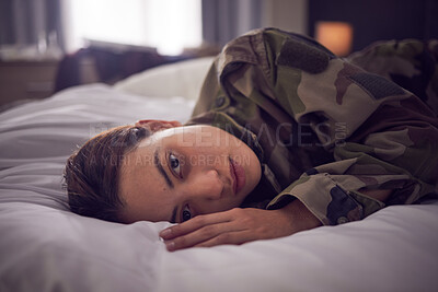 Buy stock photo Depressed female soldiers in mental health issues, sleepless or nightmare in the bedroom. Woman, stress and depression lying on bed in military suffering from insomnia or mental disorder at home. 