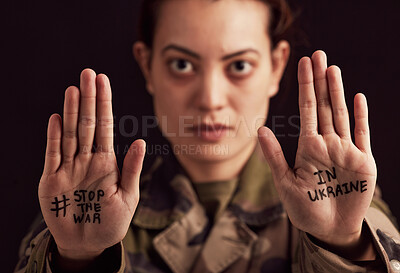 Buy stock photo Ukraine, war and stop with woman soldier showing her hands or palms in protect to military conflict. Army, freedom and politics with a female trooper in support of Ukrainian freedm or rights