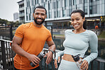 Black couple, happy and fitness partner in urban portrait, water bottle for hydration and relax after exercise. Happy, smile and black man with black woman, wellness and active lifestyle in Chicago.