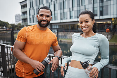 Buy stock photo Black couple, portrait and fitness in urban city, workout partner with water bottle for hydration and relax after exercise. Happy black man with black woman and wellness, active lifestyle in Chicago.
