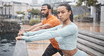 Exercise, couple in the rain and  stretching for workout, fitness and wellness. Wet, man or woman training, practice routine or motivation for health, commitment or sports for energy, cardio or power