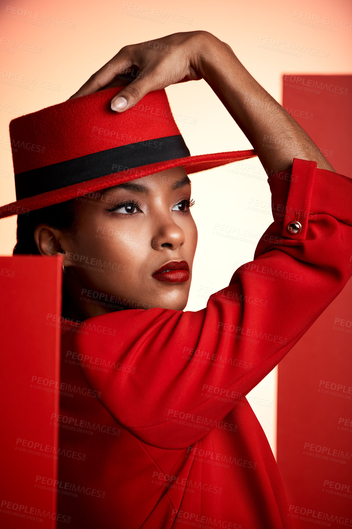 Buy stock photo Beauty, fashion and aesthetic woman in red suit for cosmetics, makeup and designer brand clothes advertising while thinking about color. Face of strong 90s retro model in studio for empowerment