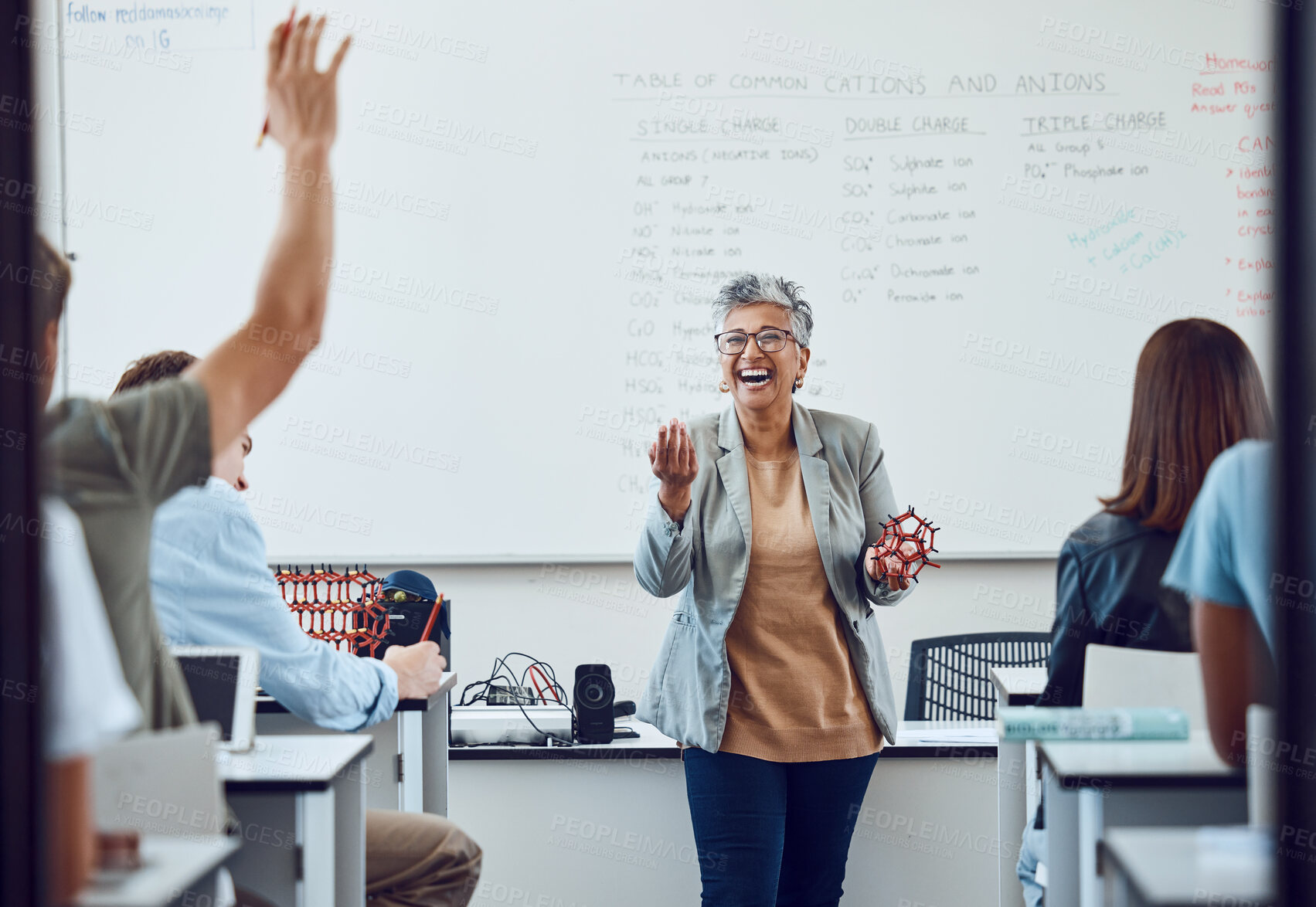 Buy stock photo Classroom, teacher and science question at school university or college with dna model in education, learning and teaching. Physics professor with students happy for development or knowledge trust