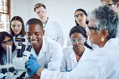 Buy stock photo Education, science and teacher with students using microscope for chemistry, biology and medical research . Medicine, healthcare lab and mentor with university class to study analytics of dna sample