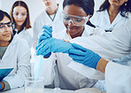 Science, teamwork and students chemical experiment or demonstration in laboratory for healthcare innovation or college exam. Scientist, medical team and pharmaceutical research or analysis study