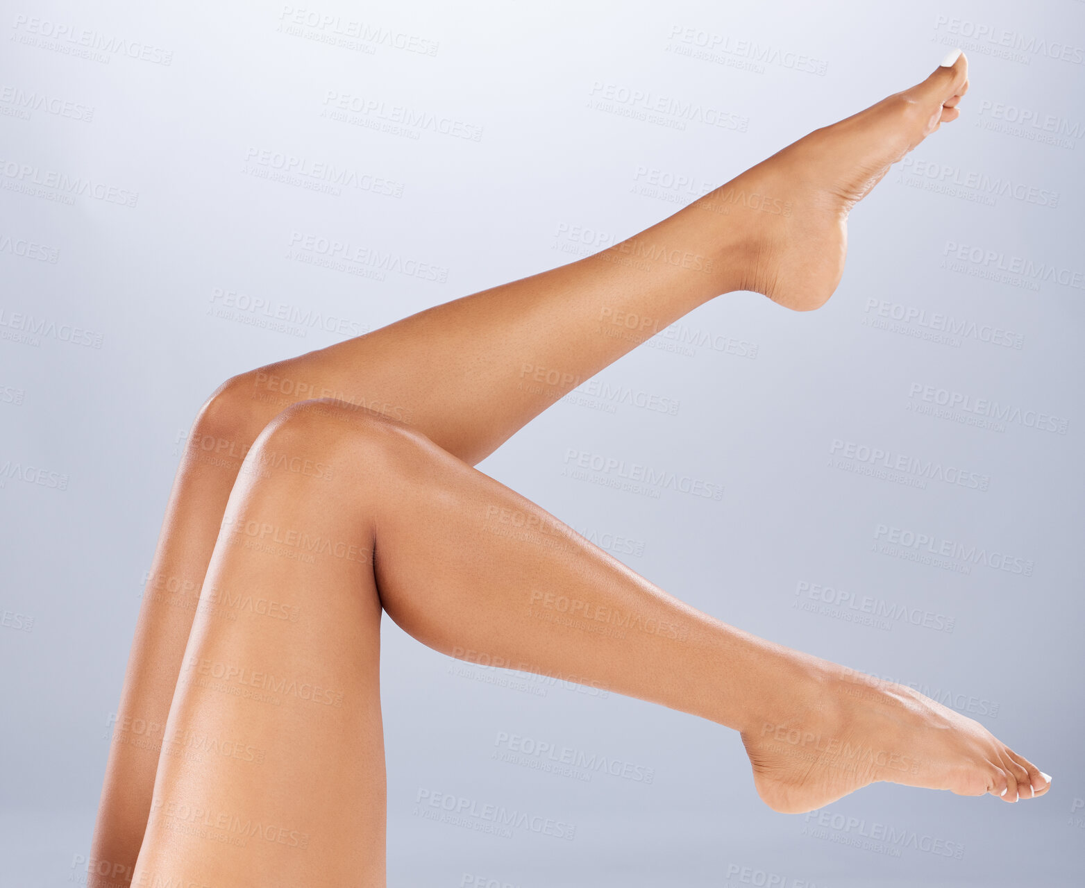 Buy stock photo Legs, wellness and skincare for cosmetics, health or on grey studio background. Leg, grooming or smooth skin with soft, leg or self care for wellbeing, shaving or beauty for epilation at spa barefoot