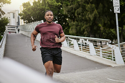 Buy stock photo Running, fitness and black man on bridge or in the city for body workout, cardio goals and marathon training with speed, energy and focus. Portrait of sports runner in usa street for a fast exercise