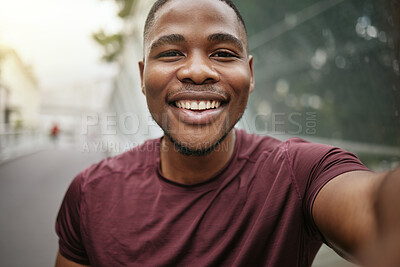 Buy stock photo Fitness, portrait or black man taking a selfie in a city for social media marketing online content or running exercise blog. Face, pictures or happy African runner smiles with pride or freedom 