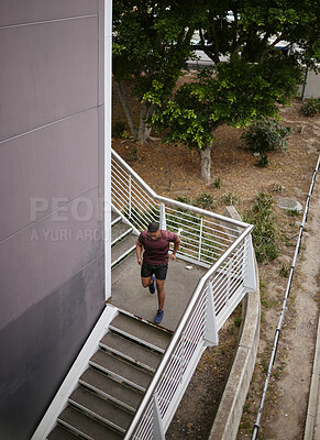 Buy stock photo Running, fitness and training with man on stairs for sports, workout and cardio endurance. Mindset, challenge and focus with runner on steps of building for speed, exercise and sports marathon
