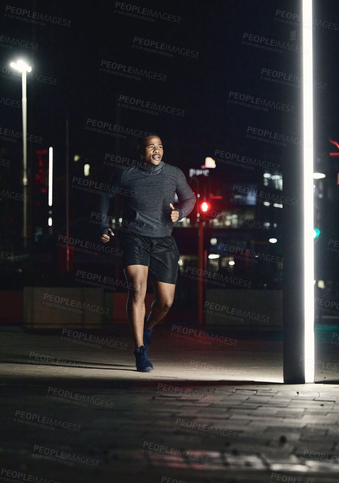 Buy stock photo Running, fitness and man in night city for training muscle, body goals and lose weight challenge in motivation, energy and speed. Sports, athlete and cardio runner in the dark or urban street lights