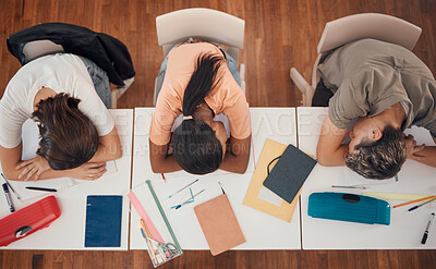 Buy stock photo Sleeping, study and desk group students with learning, education and school fatigue, depression or mental health risk. Burnout, stress and tired friends with books on table in library or school above