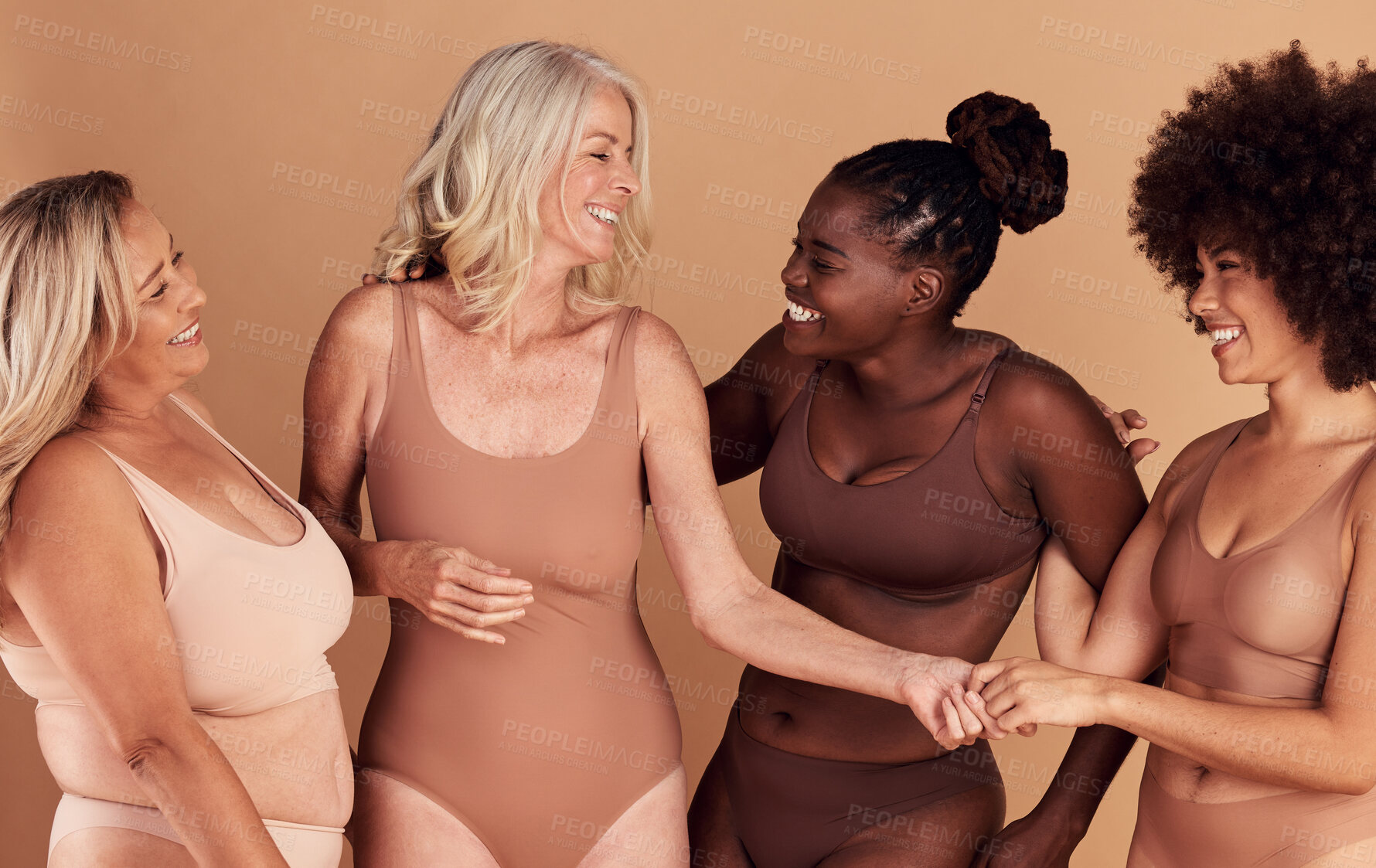 Buy stock photo Diversity, women and skincare for body positivity, cosmetics or conversation on brown studio background. Health females and multiracial ladies with confidence, wellness or talking with smile or laugh