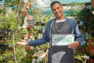 Buy stock photo Plants, garden or manager with a hiring sign at a small business with flowers, nature or growth sustainability. Portrait, job offer or happy business owner with an onboarding banner in gardening shop