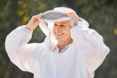 Buy stock photo Beekeeper, safety suit and senior farm worker woman ready for honey, bee and produce production. Happy, agriculture and elderly sustainability worker in garden or field with a smile with safety 