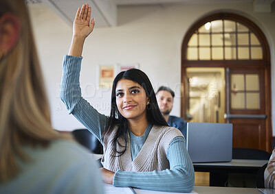 Buy stock photo Classroom, woman and students hand for learning at university, ask question and studying for education. Indian woman, college scholarship and arm in air for course happiness at lecture hall table