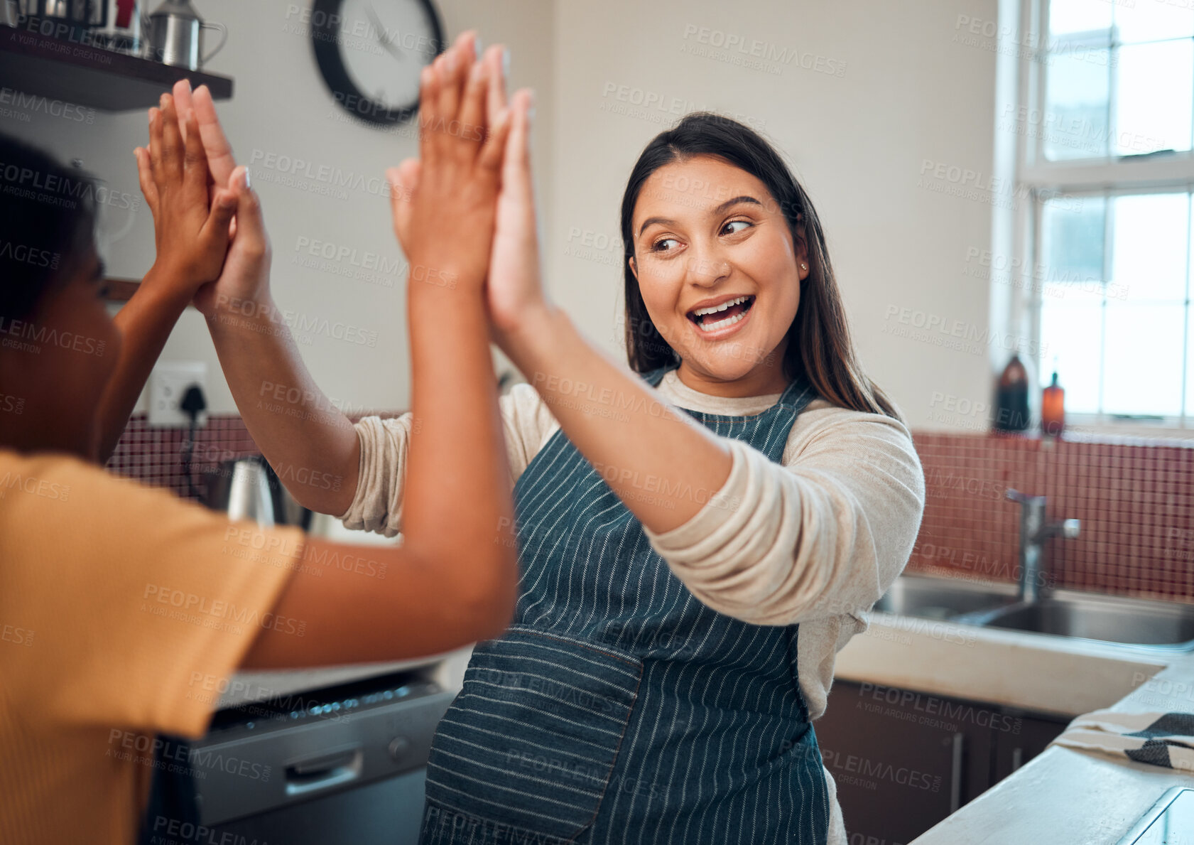 Buy stock photo Happy family, mother and girl high five for cooking support, learning or child development in a house kitchen. Goals, success or excited mom loves teaching a young kid baker baking or food skills 