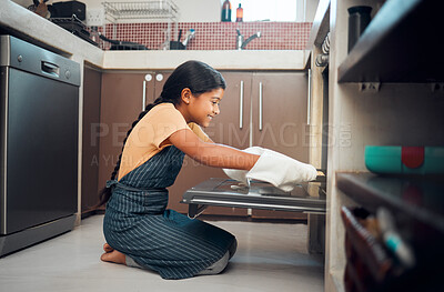 Buy stock photo Cooking, oven and girl child in kitchen holding tray after baking in home. Learning, education and happy kid teaching herself how to bake pastry, having fun and enjoying quality time alone in house.