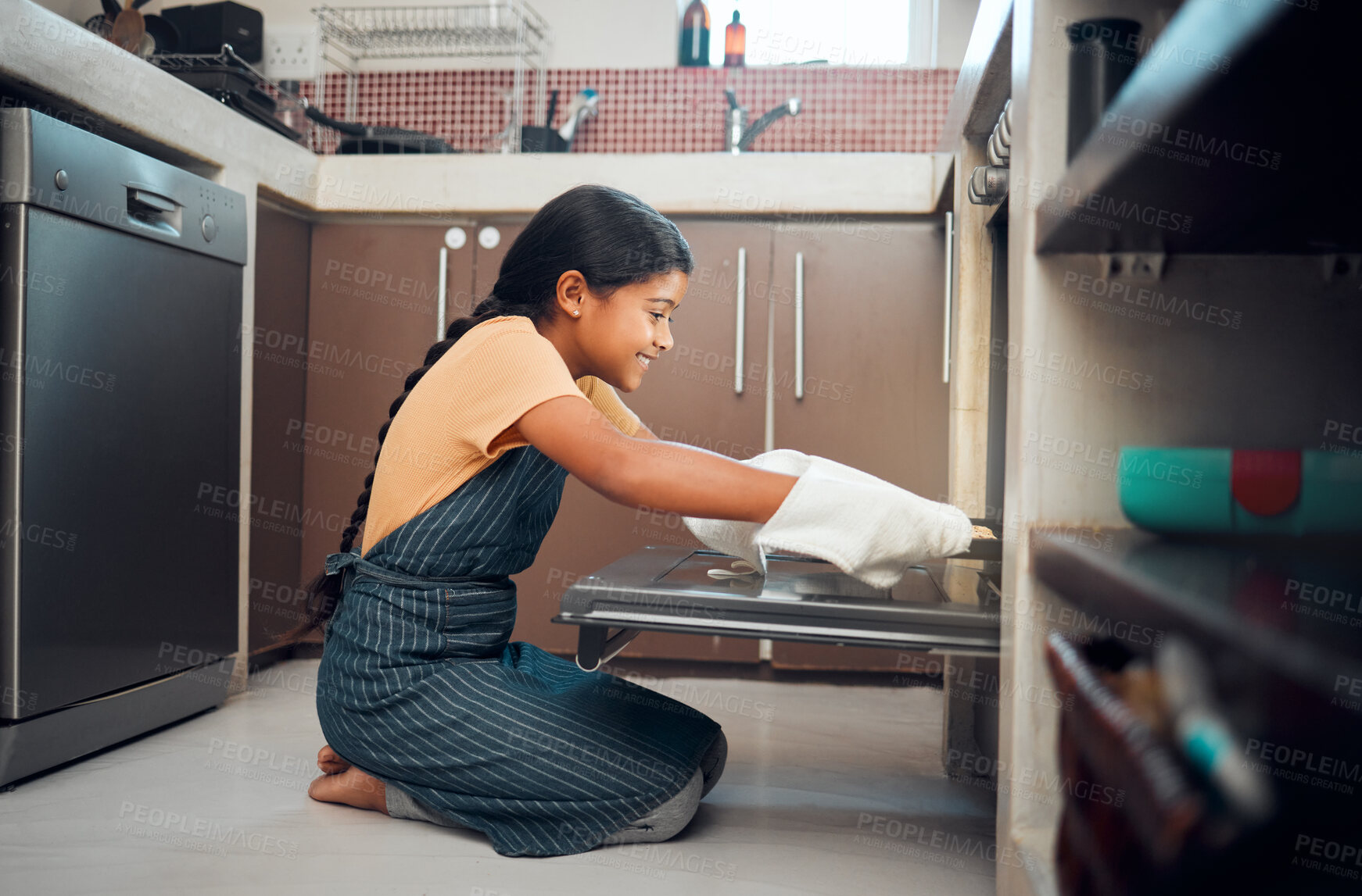 Buy stock photo Cooking, oven and girl child in kitchen holding tray after baking in home. Learning, education and happy kid teaching herself how to bake pastry, having fun and enjoying quality time alone in house.