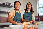 Happy family, mother and girl baking a cake, cookies or muffin in a kitchen laughing at home. Eggs, funny mom and young child holding a rolling pin for flour, wheat or dough learning cooking skills
