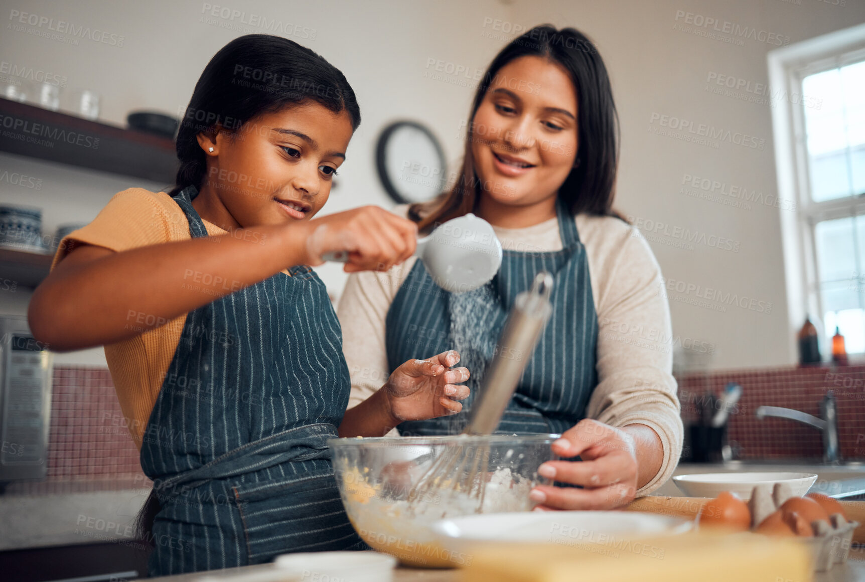 Buy stock photo Help, learning and cooking food with mother in kitchen for lesson, independence and bonding moment. Focus, teaching and mom helping child with baker recipe at happy family home in Mexico.
