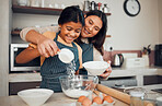 Family, baking and helping with food in home kitchen with mother and daughter learning to make dessert with wheat flour and eggs. Happy woman teaching girl kid about cooking for fun bonding