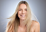 Hair care, wellness and portrait of a happy woman in studio with brazilian, keratin or botox hair treatment. Happiness, smile and female model from Australia with long, shiny and straight hair style.