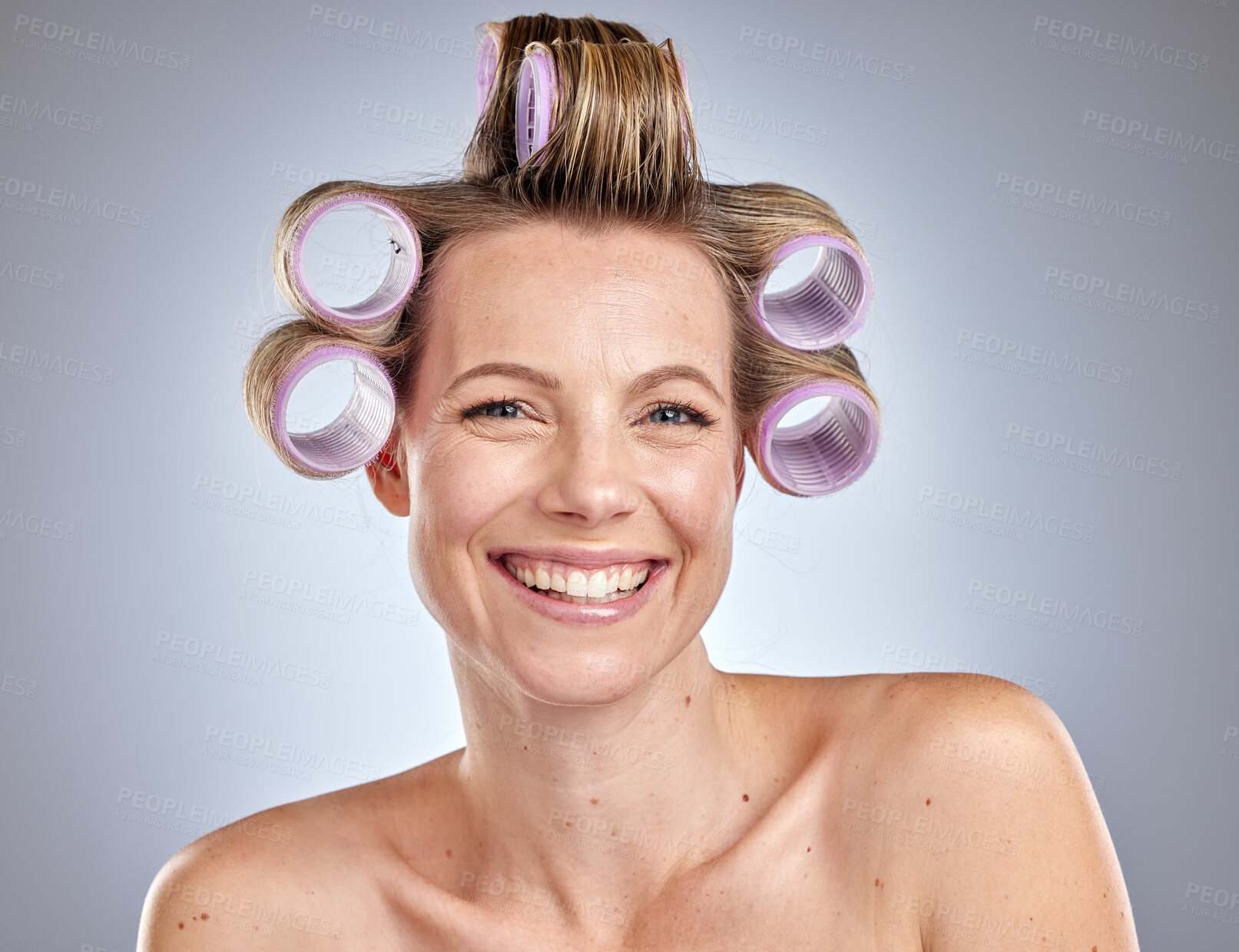 Buy stock photo Face, hair care and woman with hair roller in studio isolated on gray background. Beauty portrait, makeup and cosmetics of happy female model with salon hair treatment or curler product for hairstyle