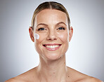 Skincare, facial and portrait of woman with cream, lotion and skincare products on gray background studio. Spa, body wellness and face cream on female for dermatology, facial treatment and cosmetics
