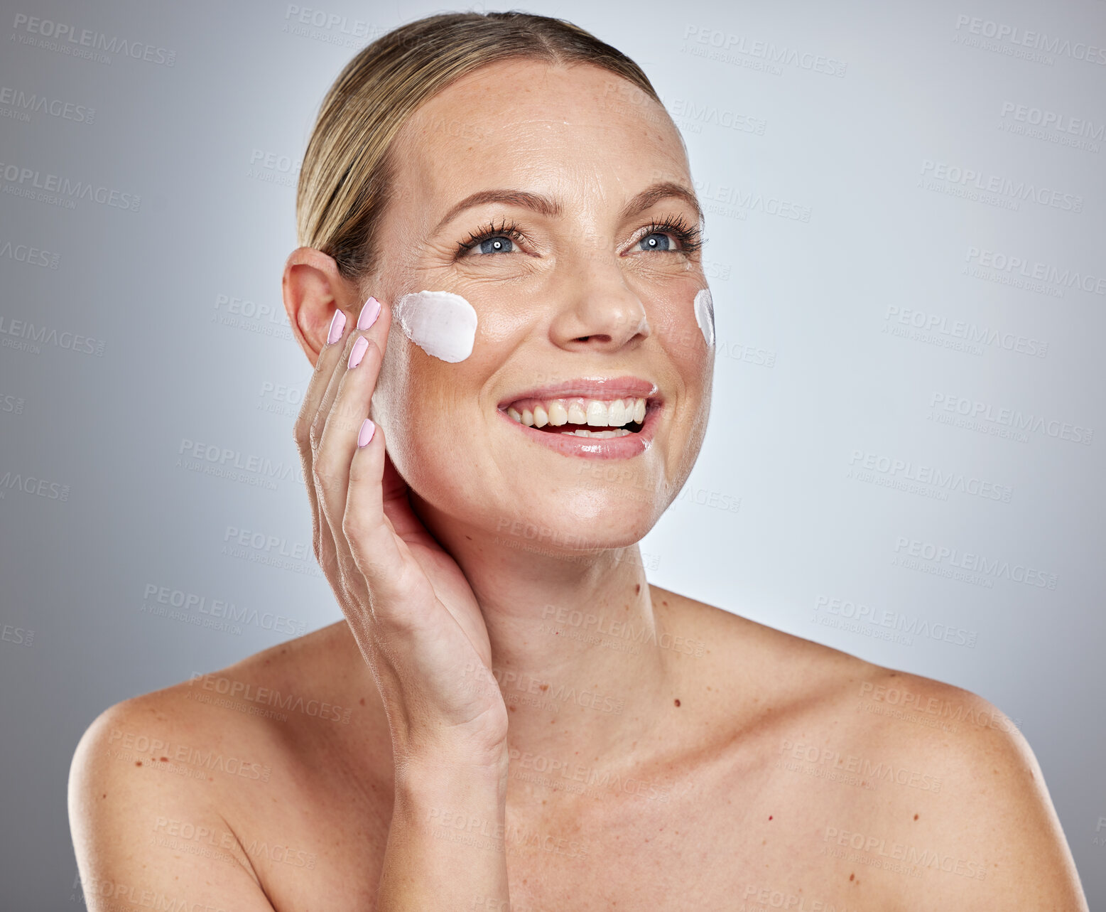 Buy stock photo Skincare, cream and beauty woman in studio with cosmetics, makeup and product promotion, marketing and advertising. Happy skin care model, facial cleaning or sunscreen for dermatology glow and shine