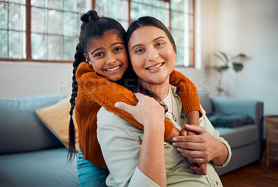 Buy stock photo Pregnancy, hug and child with mother, love and peace in the living room of their home. Affection, happy family and portrait of a pregnant woman with a girl kid hugging during maternity leave