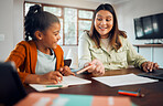 Education, home school and homework with a student girl and mother learning at a table in their house. Family, writing and kids with a woman and female child reading for growth or development