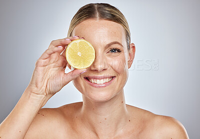 Buy stock photo Woman, lemon and natural skincare portrait for glow, beauty wellness and luxury citrus fruit treatment in grey studio background. Happy, model smile and vitamin c dermatology or spa facial nutrition